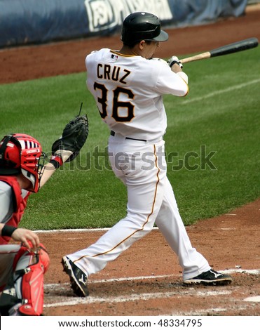 PITTSBURGH - SEPTEMBER 24 : Luis Cruz of the Pittsburgh Pirates swings at a pitch against Cincinnati Reds on September 24, 2009 in Pittsburgh, PA.