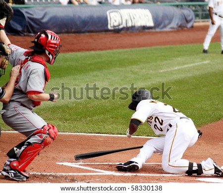PITTSBURGH - SEPTEMBER 24 : Andrew McCutchen of the Pittsburgh Pirates is knocked down by a close pitch against Cincinnati Reds on September 24, 2009 in Pittsburgh, PA.