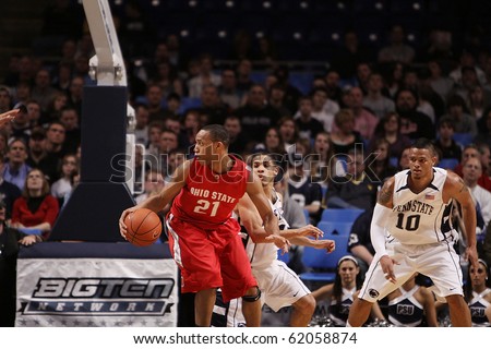 UNIVERSITY PARK, PA - FEBRUARY 24: Ohio State guard Evan Turner #21 spins and dribbles around Penn State\'s defense  at the Byrce Jordan Center February 24, 2010 in University Park, PA