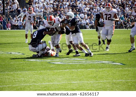 UNIVERSITY PARK, PA - OCT 9: Illinois running back Jason Ford #21 is tackled by Penn State\'s  #28 Drew Astorino at Beaver Stadium October 9, 2010 in University Park, PA