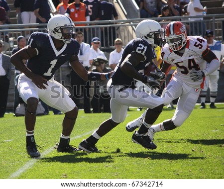 UNIVERSITY PARK, PA - OCT 9: Penn State quarterback Robert Bolden hands the football to No. 21 Stephon Green during a game against Illinois  at Beaver Stadium on October 9, 2010 in University Park, PA