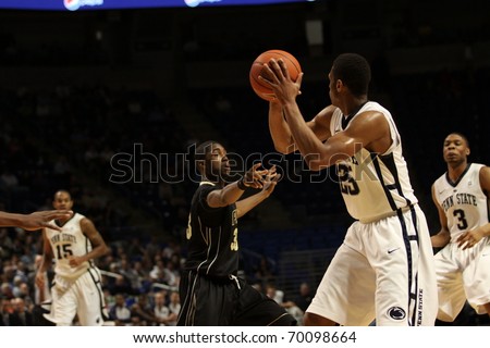 UNIVERSITY PARK, PA - JANUARY 5: Penn State\'s Jeff Brooks looks for a pass as Purdue\'s E\'Twaun Moore defends at the Byrce Jordan Center on January 5, 2011 in University Park, PA