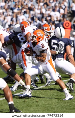 UNIVERSITY PARK, PA - OCT 9: Illinois quarterback No. 2, Nathan Scheelhaase runs between the tackles against Penn State at Beaver Stadium on October 9, 2010 in University Park, PA