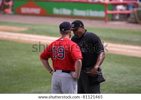 BINGHAMTON, NY - JULY 7: Portland Sea Dogs manager Kevin Boles has a discussion with the umpire in a game against the Binghamton Mets at NYSEG Stadium on July 7, 2011 in Binghamton, NY