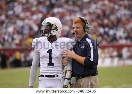 PHILADELPHIA, PA. - SEPTEMBER 17: Penn State Quarterback back Robert Bolden talks strategy with Coach McQueary against Temple on September 17, 2011 at Lincoln Financial Field in Philadelphia, PA.