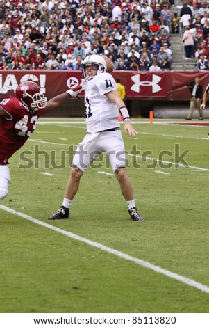 PHILADELPHIA, PA. - SEPTEMBER 17: Penn State Quarterback back Matthew McGloin is pressured by Temple\'s Adrian Robinson in a game on September 17, 2011 at Lincoln Financial Field in Philadelphia, PA.