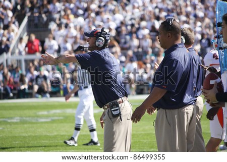 UNIVERSITY PARK, PA - OCT 9: Illinois defensive coaches call out the signals during a game against Penn State at Beaver Stadium on October 9, 2010 in University Park, PA