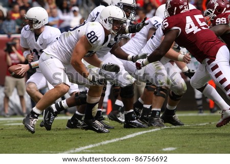 PHILADELPHIA, PA. - SEPTEMBER 17: Penn State quarterback Matthew McGloin moves to hand the football off in a game against Temple on September 17, 2011 at Lincoln Financial Field in Philadelphia, PA.