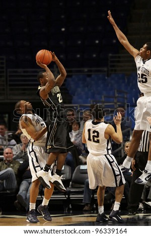 UNIVERSITY PARK, PA - JANUARY 5: Purdue\'s point guard Lewis Jackson looks to shoot as Penn State\'s Jeff Brooks defends the basket at the Byrce Jordan Center on January 5, 2011 in University Park, PA