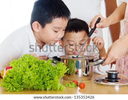 asian boys smell their mother\'s cooking