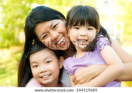 Outdoor Portrait Of Asian Mother And Daughters Stock Photo 144519689 ...