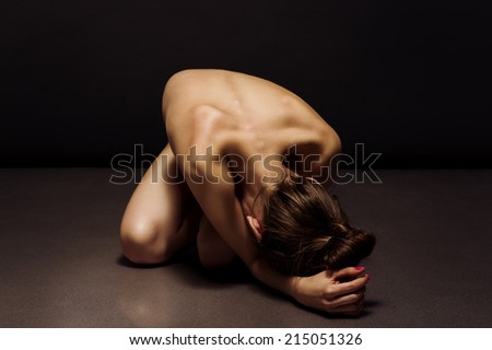 Nude sexy back and body of young female in soft light