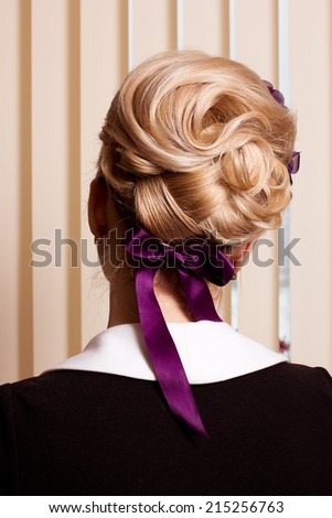 Styling. Rear View of Frizzy blond Hair Woman. Haircare Spa Salon Concept