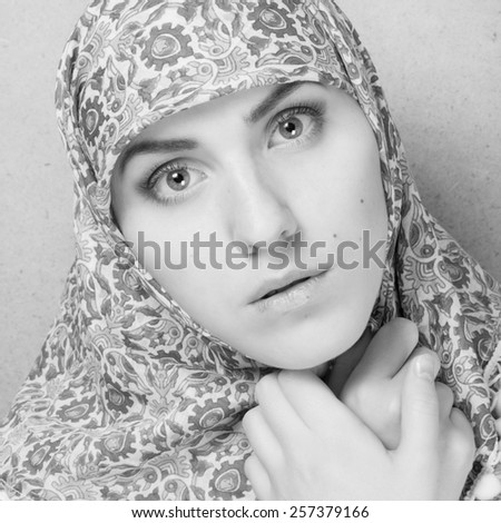 Fashion black and white portrait of young beautiful Muslim woman