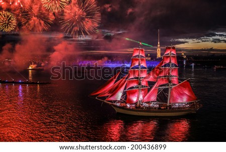 ST.PETERSBURG, RUSSIA - JUN 20, 2014: Light show and firework with a frigate with scarlet sails floating on the Neva River JUN 20, 2014 ST.PETERSBURG, RUSSIA