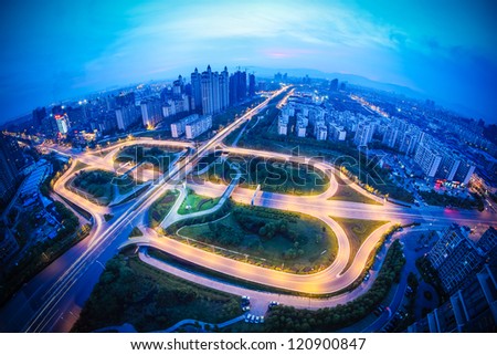 city highway interchange at dusk with fish-eye view