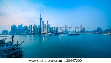 panoramic view of shanghai skyline with huangpu river at daybreak
