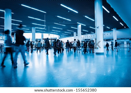 commuters in rush hour with shanghai subway transfer center hall