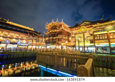 beautiful shanghai yuyuan with zigzag bridge at night,built in 1559,chinese classic garden architecture of traditional pavilions.