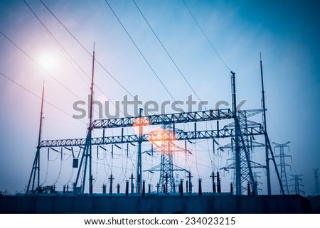 transformer substation silhouetted against dusk sky , electricity background