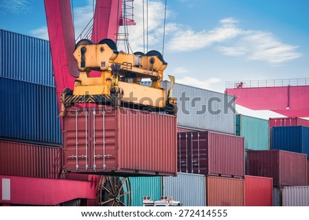 industrial crane loading and unloading and cargo containers closeup ,  modern logistics background