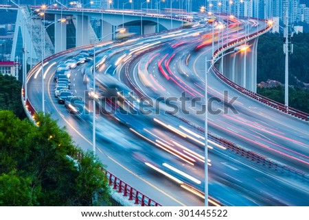 traffic flow closeup on the curve bridge