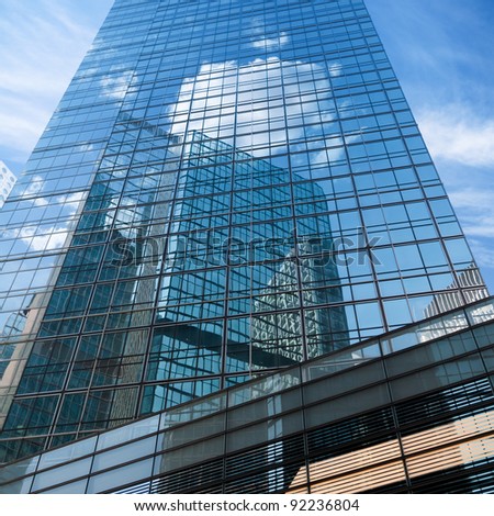 blue sky reflected in modern building mirror glass wall