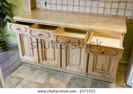 Kitchen shelf with opened drawers