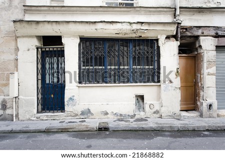Old facade of small shop at street