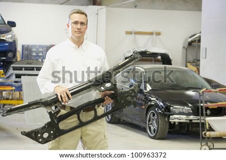 Serious Technician with Auto Body Part