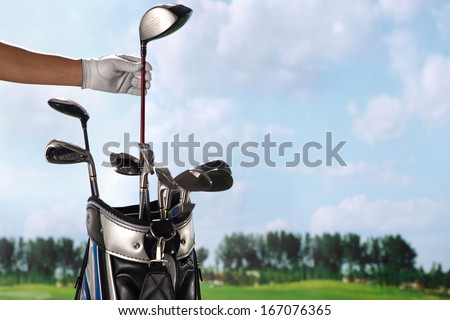 A shot of Removing golf club from bag