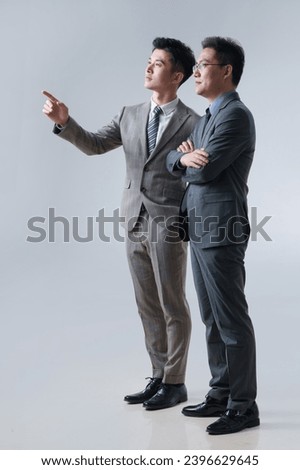 Similar – Image, Stock Photo Asian businessman standing in street