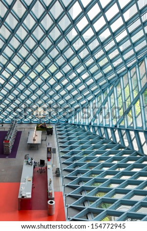 SEATTLE, WASHINGTON - AUGUST 3: Steel and glass walls and the lobby of the Seattle Central Library building on August 3, 2013 in Seattle, Washington