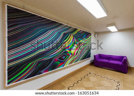 CHICAGO, ILLINOIS - NOVEMBER 4, 2013: Large colorful painting with purple couch in the Interreligious Center on the ground floor of the Rockefeller Chapel on November 14, 2013 in Chicago, Illinois