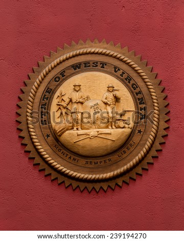 CHARLESTON, WEST VIRGINIA - DECEMBER 17: State seal carved from cherry wood in the House of Representatives chamber of the West Virginia State Capitol on December 17, 2014 in Charleston, West Virginia
