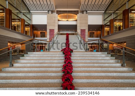 RICHMOND, VIRGINIA - DECEMBER 15: Poinsettias line the stairs in the lobby of the Library of Virginia on December 15, 2014 in Richmond, Virginia