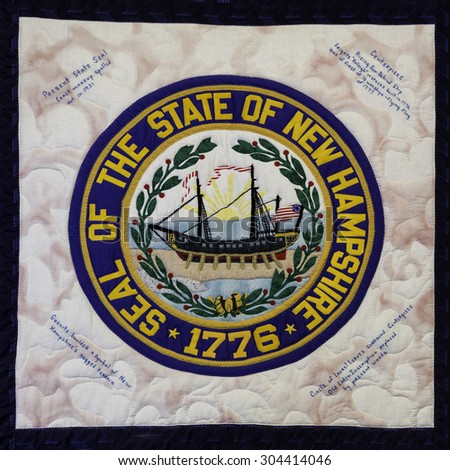 CONCORD, NEW HAMPSHIRE - JULY 28: Quilted state seal of the New Hampshire State House on July 28, 2015 in Concord, New Hampshire