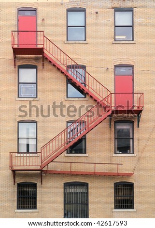 Fire escape stairs from two red doors