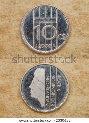 From series: coins of world. Nederlanden. On background old book. Ten cent. Diameter of 15 mm.