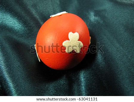 Hand crafted eggshell, painted in orange with flower - great Easter decoration