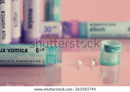 variety of boats homeopathic medicine with globules, soft warm color background