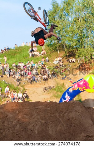 Moscow, Russia, June 06. Biker is falling from his mountain bike to the sand at Pit Jam contest, June 06, 2011 in Moscow, Russia