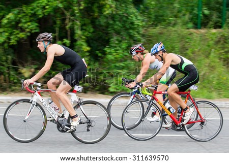 Moscow, Russia, August 16. Triathletes ride speed cycles during triathlon competition in Moscow, August 16, 2015 in Moscow, Russia