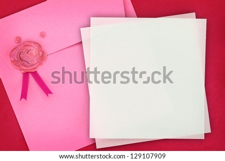 Paper envelope with heart sealing wax stamp and invitation card