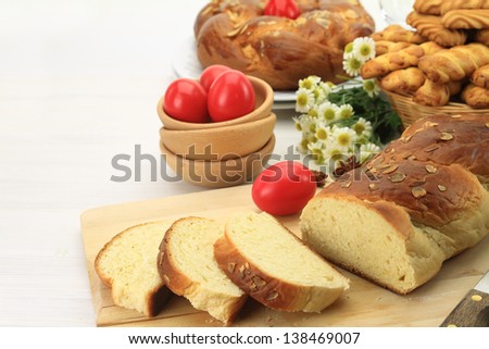 Easter sweet bread with red eggs and shortbread cookies