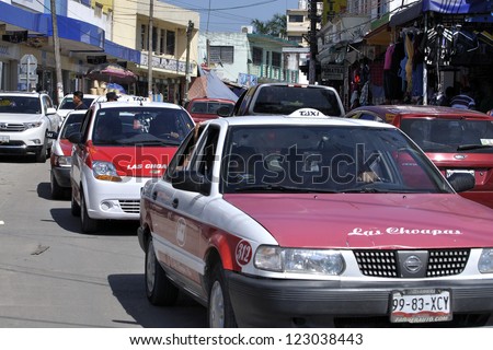 LAS CHOAPAS, VERACRUZ, MEXICO - DECEMBER 28, 2012: Downtown traffic increases in the last week of the year in downtown Las Choapas, Mexico on December 28, 2012 as people prepare for New Year\'s Eve