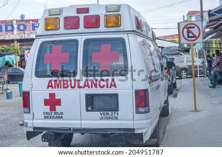 LAS CHOAPAS, MEXICO - JULY 12, 2014: A Mexican Red Cross ambulance is parked on downtown street in Las Choapas, Veracruz.  La Cruz Roja is part of the International Red Cross.