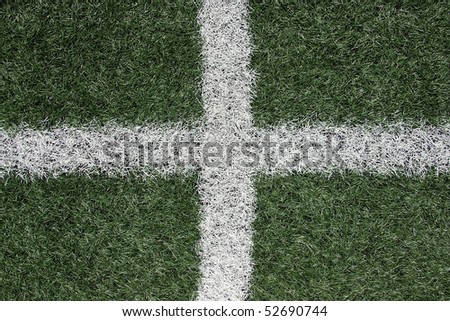 White lines crossing on turf