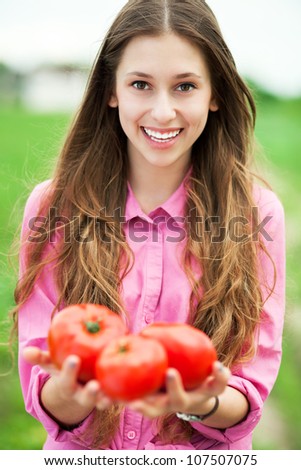 Woman Holding Fresh Tomatoes