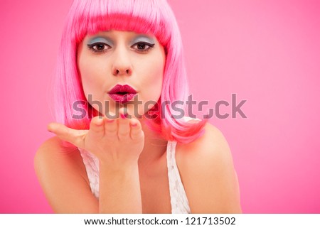 Young female blowing kiss